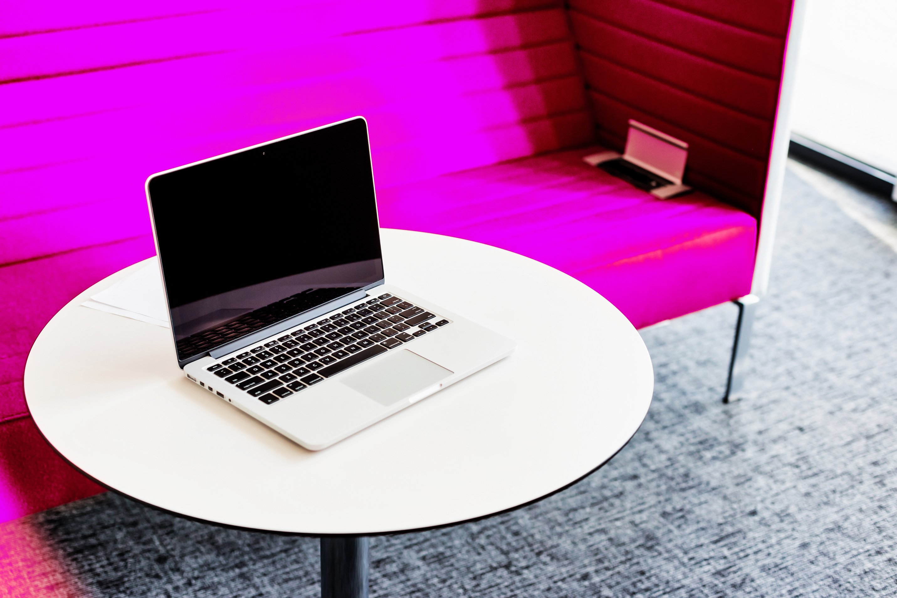 Photo of laptop on table in office